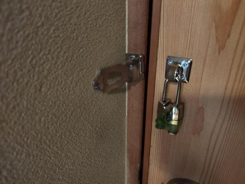 an open door with a lock on a wall at Private Room in Japanese Vintage House 民家の一室 Smoke Free, Free Parking Good to Travel for Tashiro Cats Island no1 in Ishinomaki