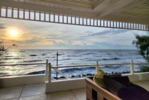 a balcony with a view of the ocean at Baan Soulmates in Ban Khung Tanot