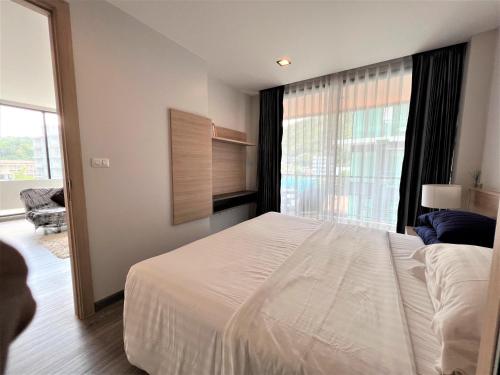 Postel nebo postele na pokoji v ubytování 1 bed Corner apartment in Kata - Grand Kata VIP