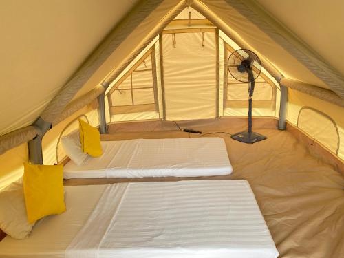 Postel nebo postele na pokoji v ubytování FAT MERMAID GUESTHOUSE