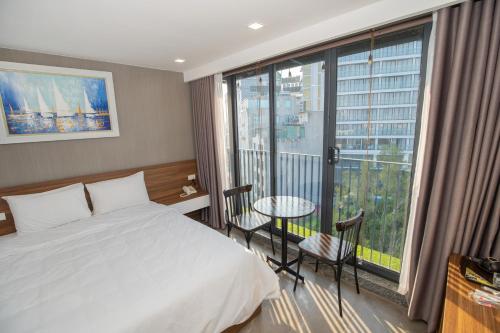 a hotel room with a bed and a large window at Lake View Hotel in Hanoi