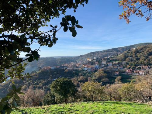 a view of a town from a hill at Casetta Genneria in Seùlo