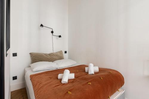 DIFY Harmony - Quartier Ainay tesisinde bir odada yatak veya yataklar
