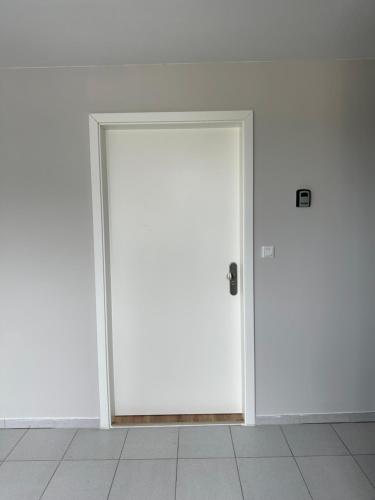 an open door in a room with white walls at Lofts V26 in Essen