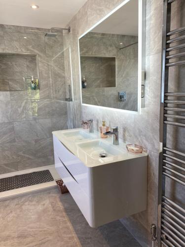 a bathroom with a sink and a shower at SUMMERPLACE in Padstow
