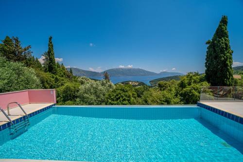 a swimming pool with a view of the water at Villa Helios Sea View & Private Pool near Fiskardo in Fiskardo