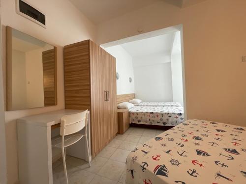 Ένα ή περισσότερα κρεβάτια σε δωμάτιο στο Hotel Status