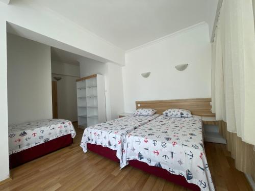 Ένα ή περισσότερα κρεβάτια σε δωμάτιο στο Hotel Status