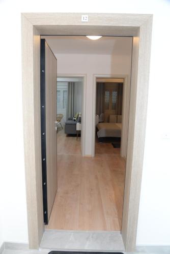 a view of a living room through a mirror at Dino & Gorge Apartments in Gevgelija