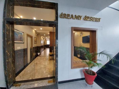 a hallway of a dream desert store with a potted plant at Dreamy Desert Hotel in Haldwāni