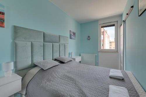 Кровать или кровати в номере Gdańsk Centrum - Apartament Anna