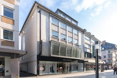 a building on the corner of a street at Arbio I Central Apartments Koblenz in Koblenz