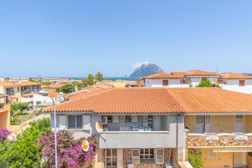 a view of a house with an orange tile roof at Myosotis Terrace by DomusAway in Porto San Paolo