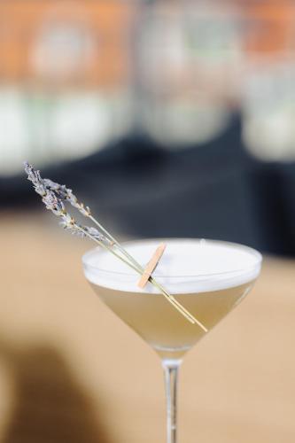 a martini glass with a stick in it at Hôtel & Appartements Monsigny in Nice