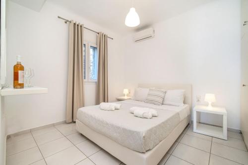 Ένα ή περισσότερα κρεβάτια σε δωμάτιο στο Overview Mykonos Apartments