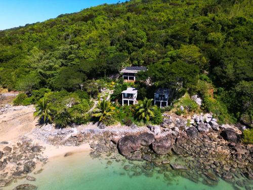 an aerial view of a house on a tropical island at Komba on the Rocks in Nosy Komba