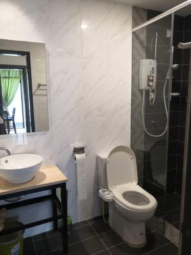 a bathroom with a toilet and a sink and a shower at Condo with great view in PJ in Petaling Jaya