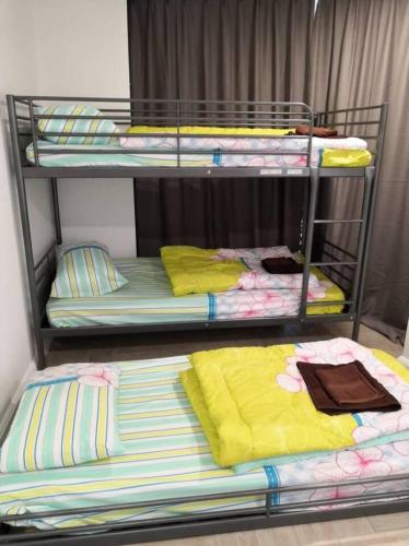 two bunk beds in a room next to each other at Condo with great view in PJ in Petaling Jaya