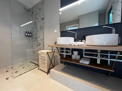 a bathroom with two sinks and a shower at Azalea Dalmacija Luxury Rooms and Apartments in Primošten