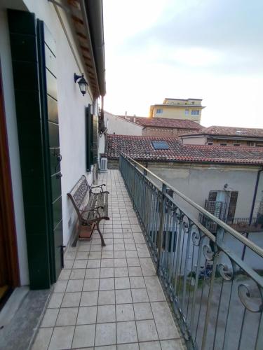 a balcony with a bench on a building at La casa di Blue in Padova
