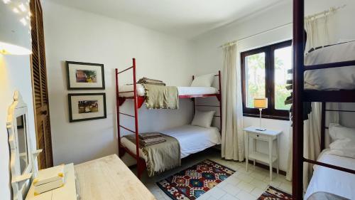 a room with two bunk beds and a window at Mar by Check-in Portugal in Albufeira