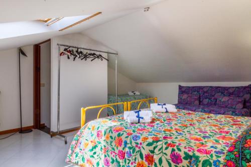 a bedroom with a bed with a colorful bedspread at Sulle Note Del Mare in Follonica