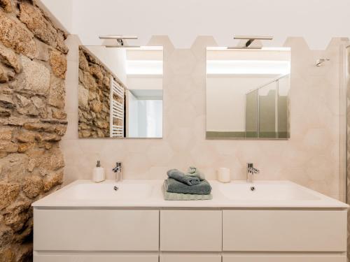 a bathroom with a white sink and a mirror at Ca Luigia in Montorfano in Mergozzo