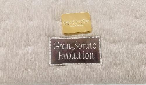 a sign that says gram sonoco equilibrium next to a gold bar at Apartment Suite - Charlize - in the heart of Milan in Milan