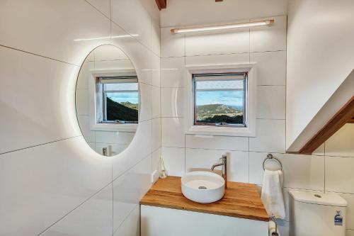 a bathroom with a sink and a mirror at The Penthouse @ Alpine Haven in Mount Hotham