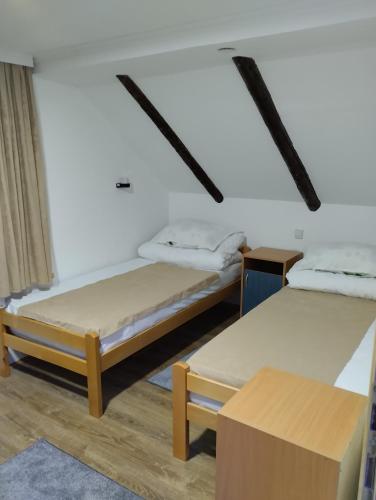 Postel nebo postele na pokoji v ubytování D&M Apartman Dojkinci