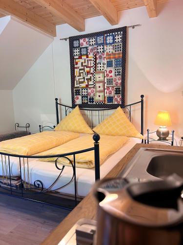 a bedroom with a bed and a tapestry on the wall at Sunhill Appartments, klimatisiert in Winhöring