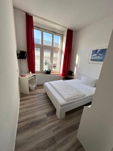 Postel nebo postele na pokoji v ubytování Hotel Astor
