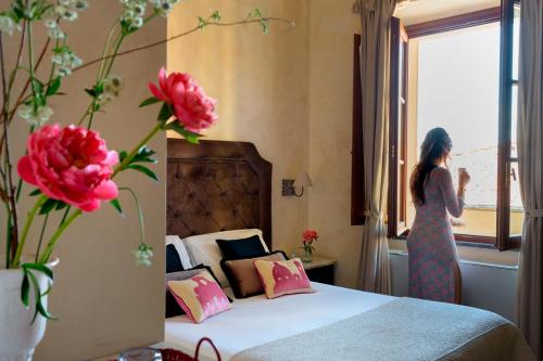 Postel nebo postele na pokoji v ubytování Mabelle Firenze Residenza Sassetti