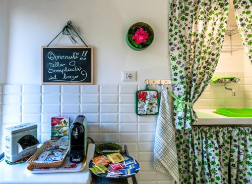a kitchen counter with a table with food on it at La Semplicità del Borgo in Bagnoregio