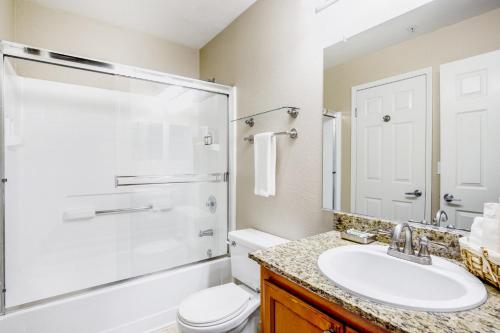 a bathroom with a sink and a toilet and a shower at Santa Clara 1BR w Parking Pool nr Dining SFO-411 in Santa Clara