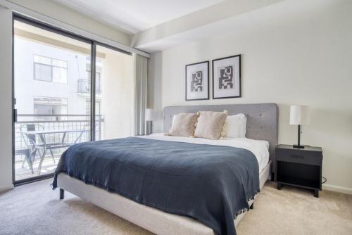 a bedroom with a large bed and a balcony at San Jose 2BR w Gym WD Pool nr Caltrain SFO-921 in San Jose