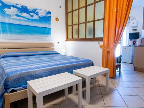 Giường trong phòng chung tại Sogni di Mare