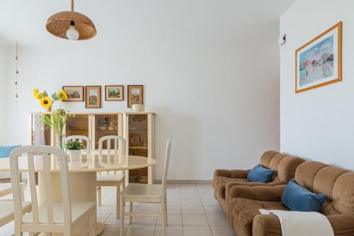 a living room with a couch and a table at Lungomare 90 - YourPlace Abruzzo in Fossacesia