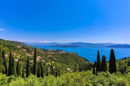 a view of a town and a lake at Villa Rose above Agni with amazing views in Kavalléraina