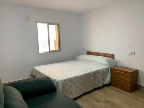 מיטה או מיטות בחדר ב-CASA VACACIONAL CONIL