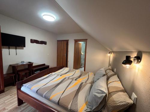 Кровать или кровати в номере Na Logu - Farm Stay Ambrož Gregorc