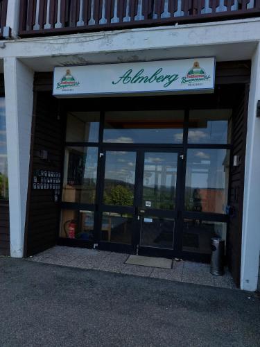 an entrance to a building with a sign on it at Apartment Almberg in Mitterfirmiansreut