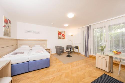 Postel nebo postele na pokoji v ubytování Appartements Ferchergasse