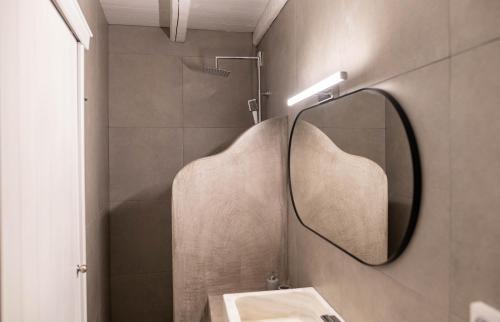 a bathroom with a mirror and a sink at Lemon tree lipsi in Leipsoi