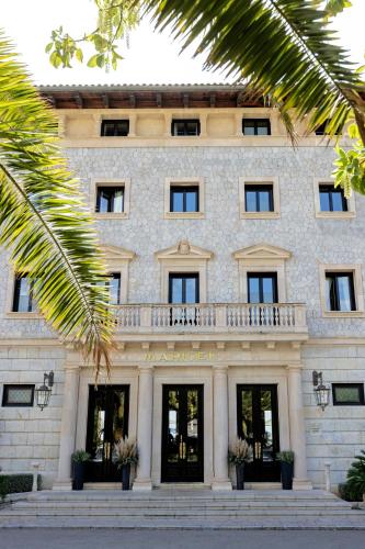 a building with a balcony on top of it at Hospes Maricel y Spa, Palma de Mallorca, a Member of Design Hotels in Cas Catala