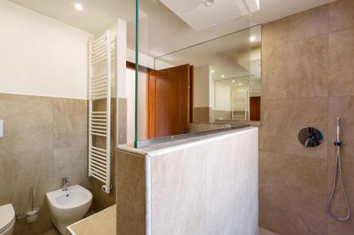 a bathroom with a shower and a toilet and a sink at Villa Sunkiss by Perle di Puglia in Pulsano
