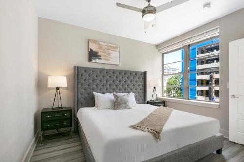 a bedroom with a large bed and a window at Amazing 4-Bedroom Haven in the Heart of New Orleans in New Orleans