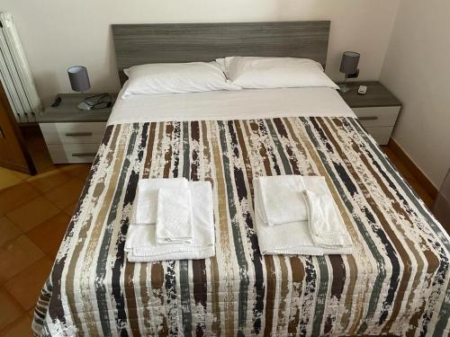 Ένα ή περισσότερα κρεβάτια σε δωμάτιο στο Ribo Apartments