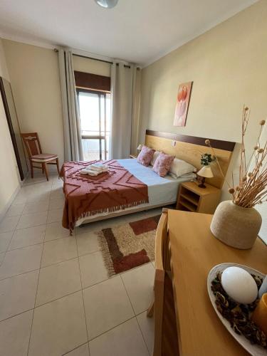 a bedroom with a bed with a red bedspread at Mantamar I in Manta Rota