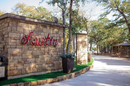 a brick wall with a sign for a museum at 7744 Ranch Glamping Resort in Austin